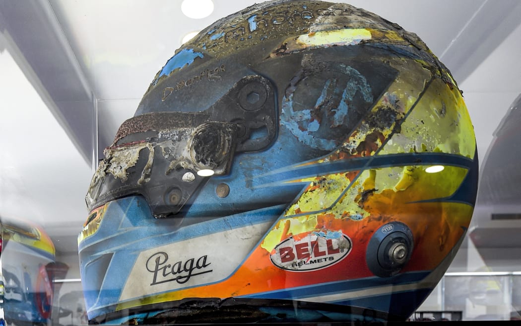 The burnt 2020 F1 Bell helmet of Haas' Swiss-French racing driver Romain Grosjean.