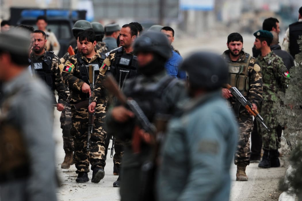 Afghan commandos and police near the election commission headquarters.