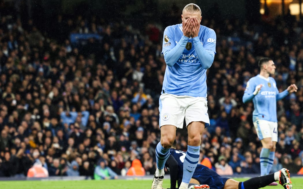 Manchester City's Norwegian striker #09 Erling Haaland reacts after missing to score during the English Premier League football match between Manchester City and Chelsea at the Etihad Stadium in Manchester, north west England, on February 17, 2024. (Photo by Darren Staples / AFP) / RESTRICTED TO EDITORIAL USE. No use with unauthorized audio, video, data, fixture lists, club/league logos or 'live' services. Online in-match use limited to 120 images. An additional 40 images may be used in extra time. No video emulation. Social media in-match use limited to 120 images. An additional 40 images may be used in extra time. No use in betting publications, games or single club/league/player publications. /