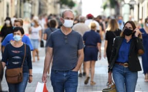 People wearing face masks, to curb the spread of Covid-19 in Nantes, western France.