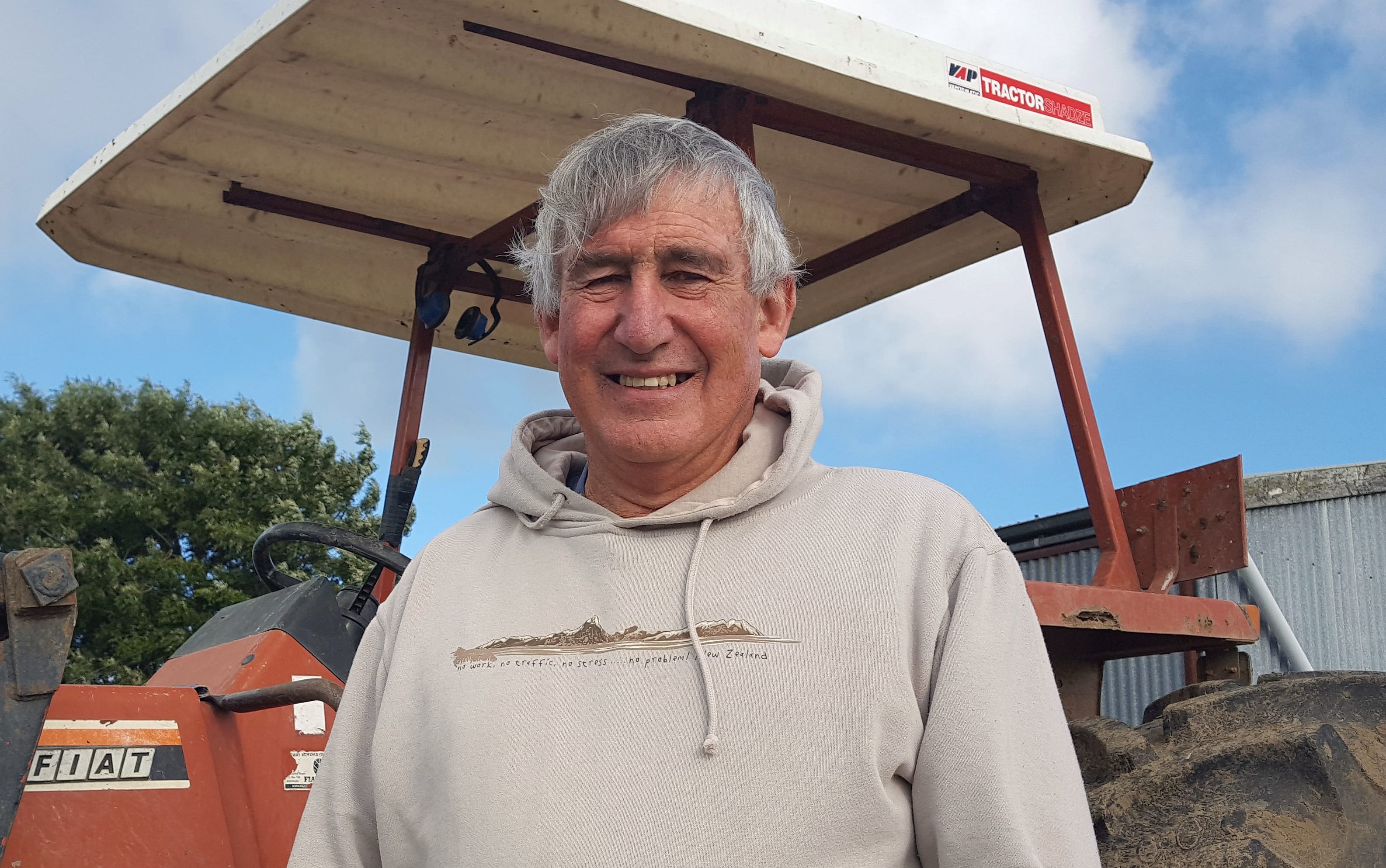 Farmer in front of his tractor