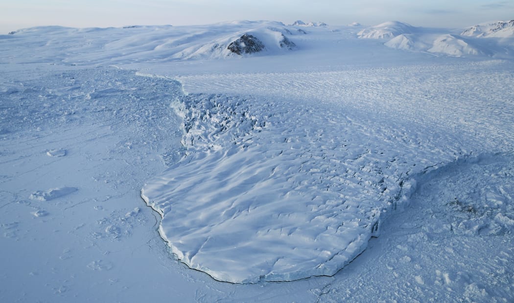 A glacier is seen from NASA's Operation IceBridge research aircraft on March 30, 2017 above Ellesmere Island, Canada. The ice fields of Ellesmere Island are retreating due to warming temperatures.