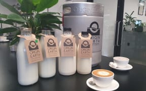 Origin Earth use refillable glass bottles and refillable milk kegs for cafes.