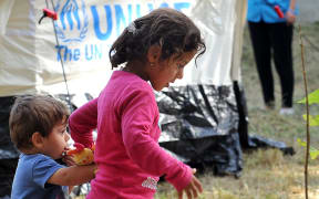Migrant children walk at the Beli Manastir refugee transit center in North-Eastern Croatia, on September 19, 2015.