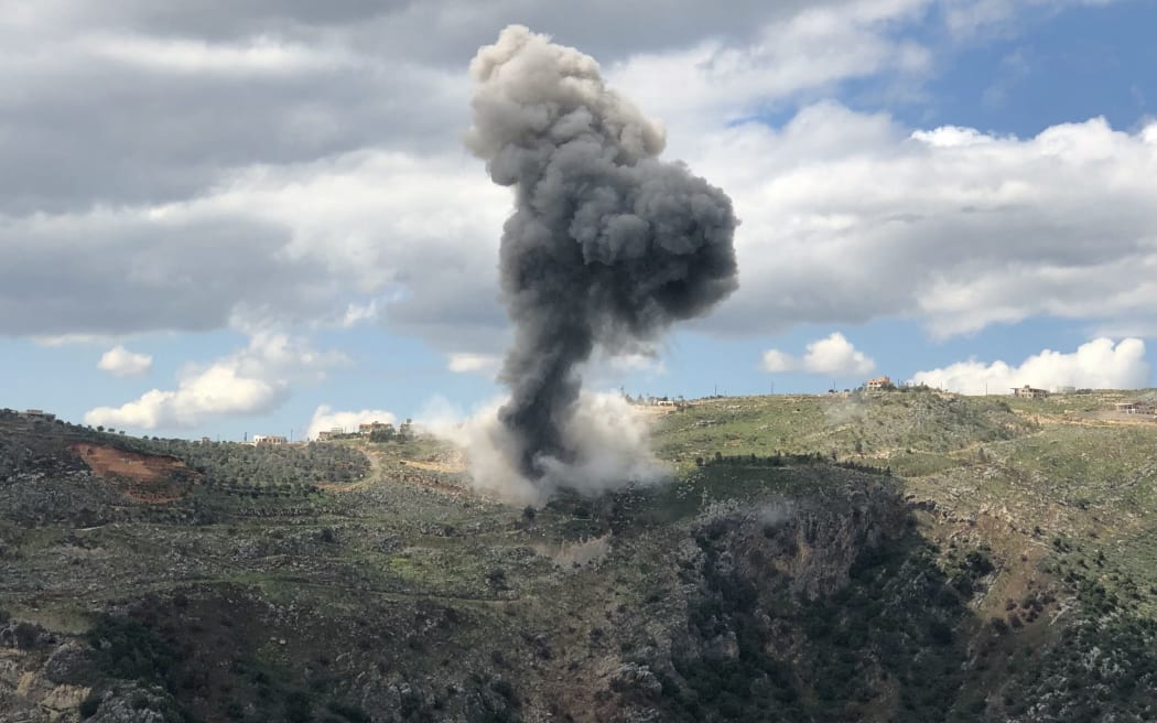 Smoke billows from the site of Israeli artillery shelling that targeted the area of the southern Lebanese village of Yohmor on March 22, 2025. An Israeli strike on the south Lebanese town of Touline killed one woman on March 22, state media reported, after Israel threatened a severe response to rockets it said had been fired from Lebanon. (Photo by Rabih DAHER / AFP)