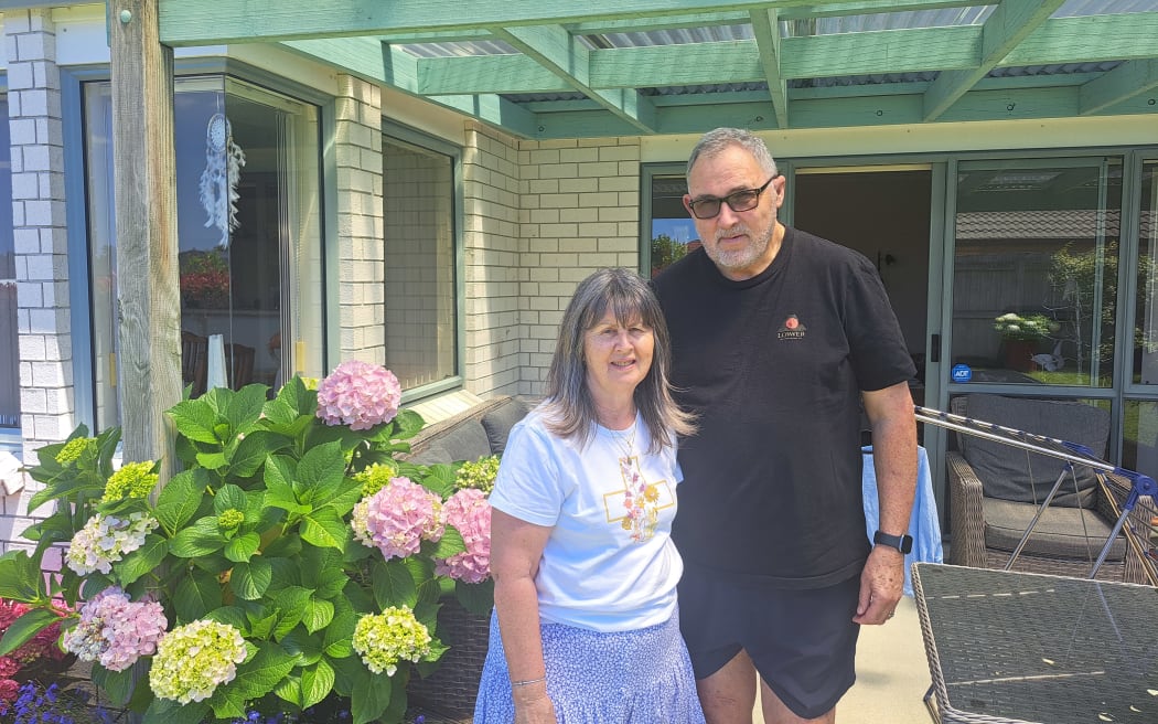 Grant and Karen Wilson outside their Te Puke home.