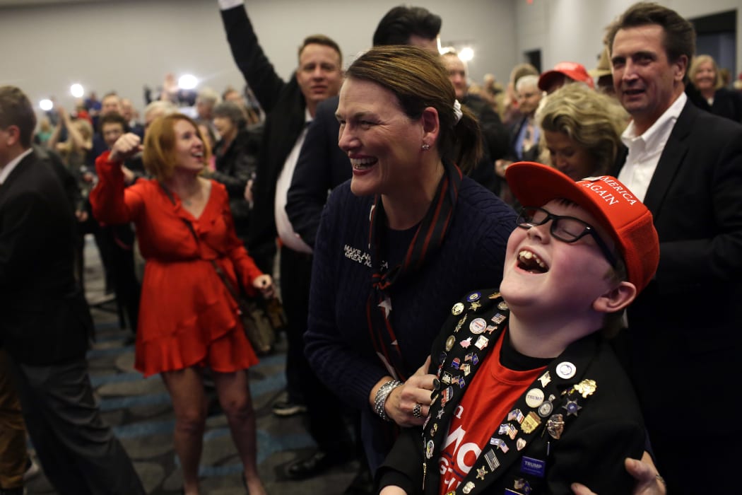 Republican supporters cheer after Incumbent Republican candidate for Iowa's Governor Kim Reynolds won re-election during Iowa's GOP Election Night.