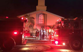 In this image obtained from the St. Lucie County Sheriff's Office, firefighters put out a blaze at the Islamic Center of Fort Pierce in Florida on 12 September.