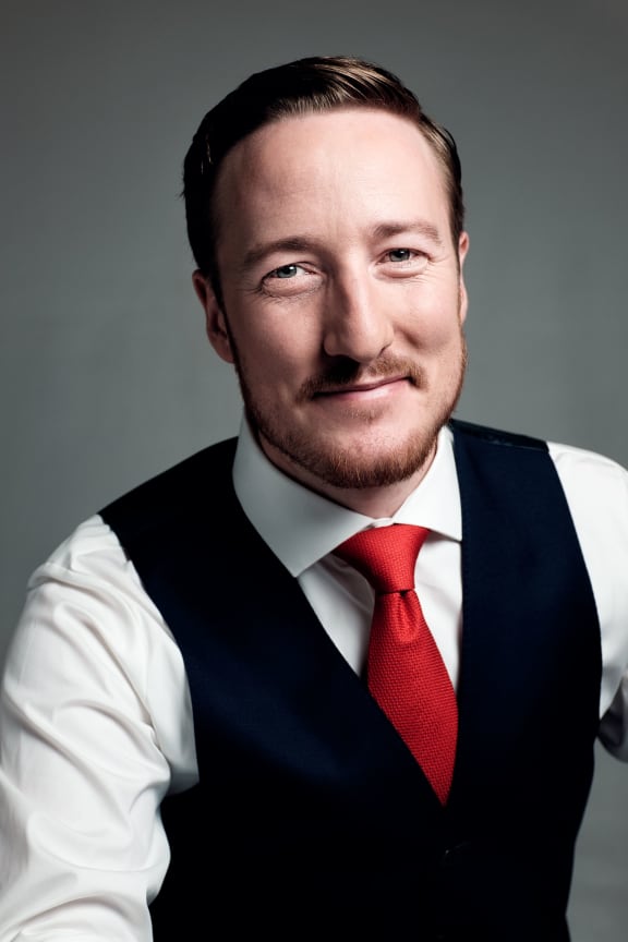 New Zealand baritone Christopher Bruerton is part of the sextet The King's Singers.
