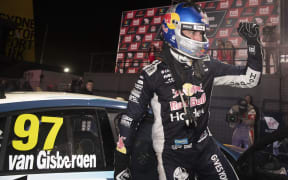 Shane van Gisbergen celebrates victory under lights in Sydney.