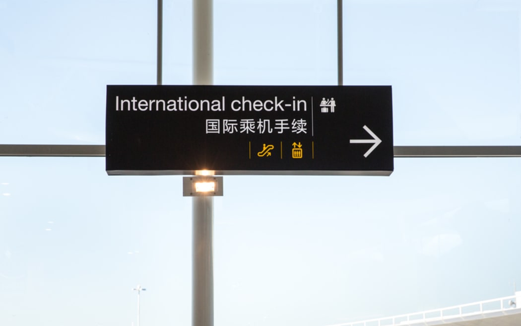 Signage for check-in at Auckland International Airport