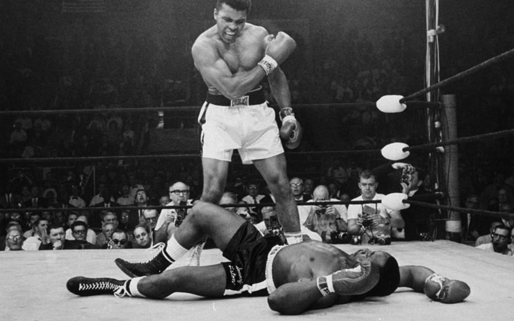 Muhammad Ali knocks down Sonny Liston in 1964.