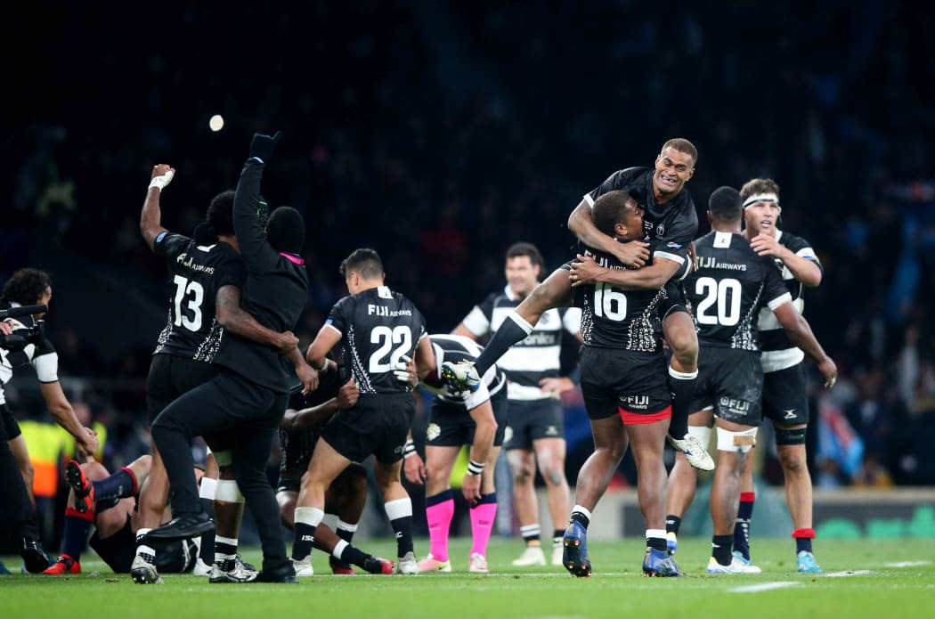 Fiji celebrate beating the Barbarians.
