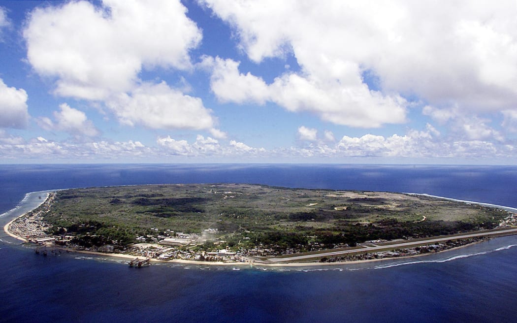 The barren and bankrupt island state of the Republic of Nauru awaits the arrival of 521 mainly Afghan refugees, 11 September 2001 which have been refused entry into Australia.  The 25-square-kilometers of land encompassing Nauru has been devastated by phosphate mining which once made the Micronesian Nauruans the second wealthiest people per capita on earth.          AFP PHOTO/Torsten BLACKWOOD (Photo by TORSTEN BLACKWOOD / AFP)