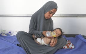 Six-month-old Jouri Abu Hajar lies in the nutrition ward at Al-Awda Hospital in Nuseirat, central Gaza, on July 22, 2025. Suffering from chronic illness and severe malnutrition, Jouri is one of many children at risk amid a catastrophic shortage of food and medicine caused by the ongoing war and blockade on Gaza.