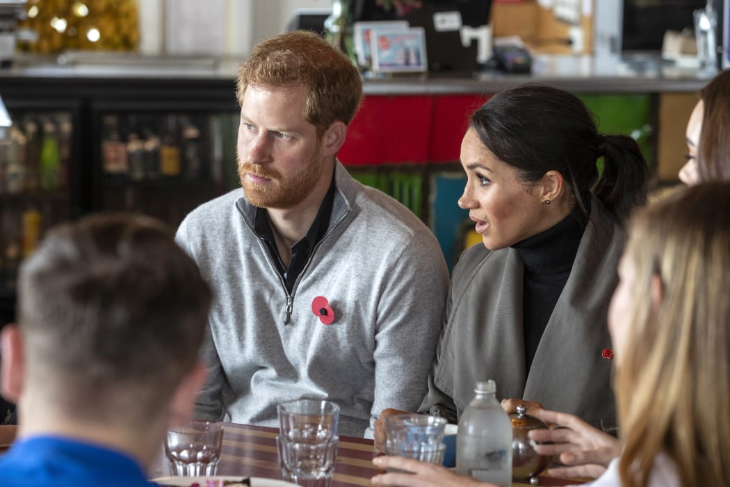 Prince Harry and his wife Meghan meet with representatives of mental health projects at Maranui cafe in Wellington.
