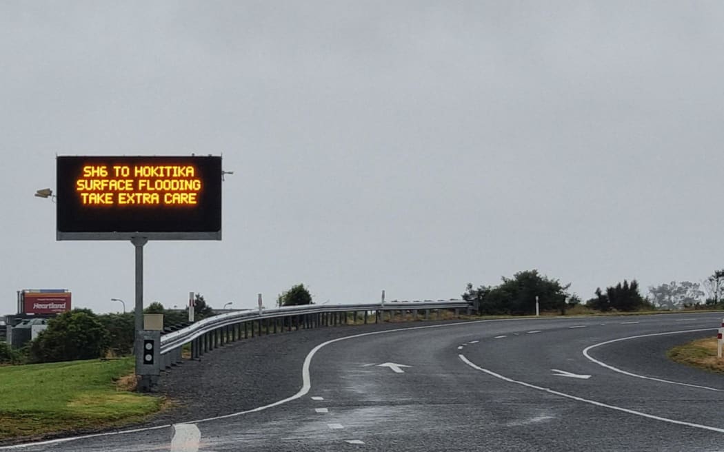 A sign just before the Haast Bridge on Thursday 18 January 2024 with MetService issuing a red rain warning for Westland until Saturday 8am.