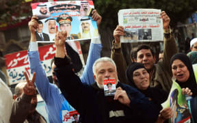Voters gather outside a polling station in Kafr el-Sheikh.