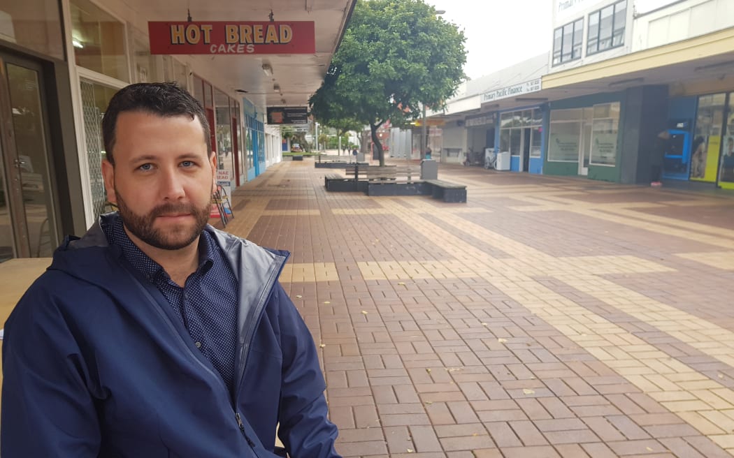 Hutt City Councillor Campbell Barry with an empty shopping centre in the background.