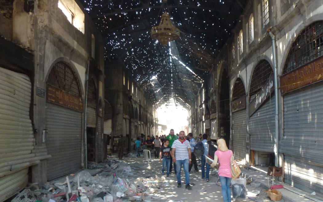 Civilians in the Souk Maskouf in Homs on Saturday after rebels left the old city.