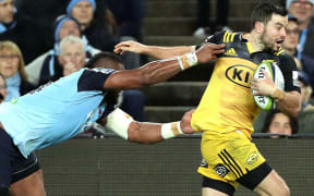 James Marshall tries to escape Taqele Naiyaravoro.