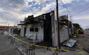 Picture released by La Tremenda Cosa showing a view of a bar that was intentionally burned and left eleven people dead in the town of San Luis Rio Colorado, Sonora state, Mexico on July 22, 2023. Eleven people died and another four were injured during the early hours of this Saturday in an intentional fire in a bar in northern Mexico, authorities reported. (Photo by Alberto De la Hoya / La Tremenda Cosa / AFP)