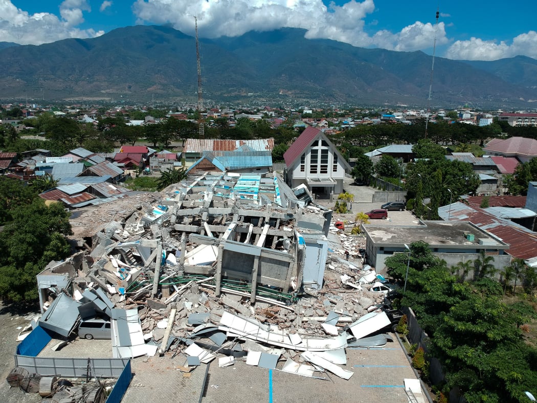 This aerial picture shows the remains of a ten-storey hotel in Palu in Indonesia's Central Sulawesi.