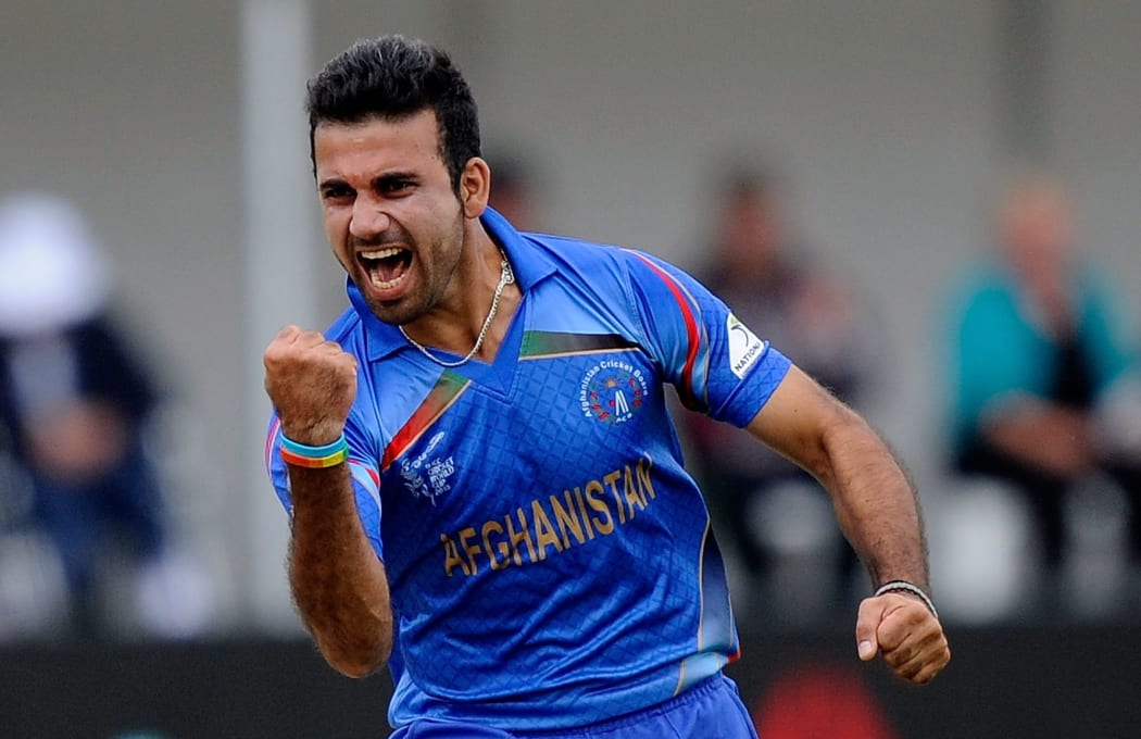 Afghanistan's Dawlat Zadran celebrates his wicket of Sri Lanka's Lahiru Thrimanne.