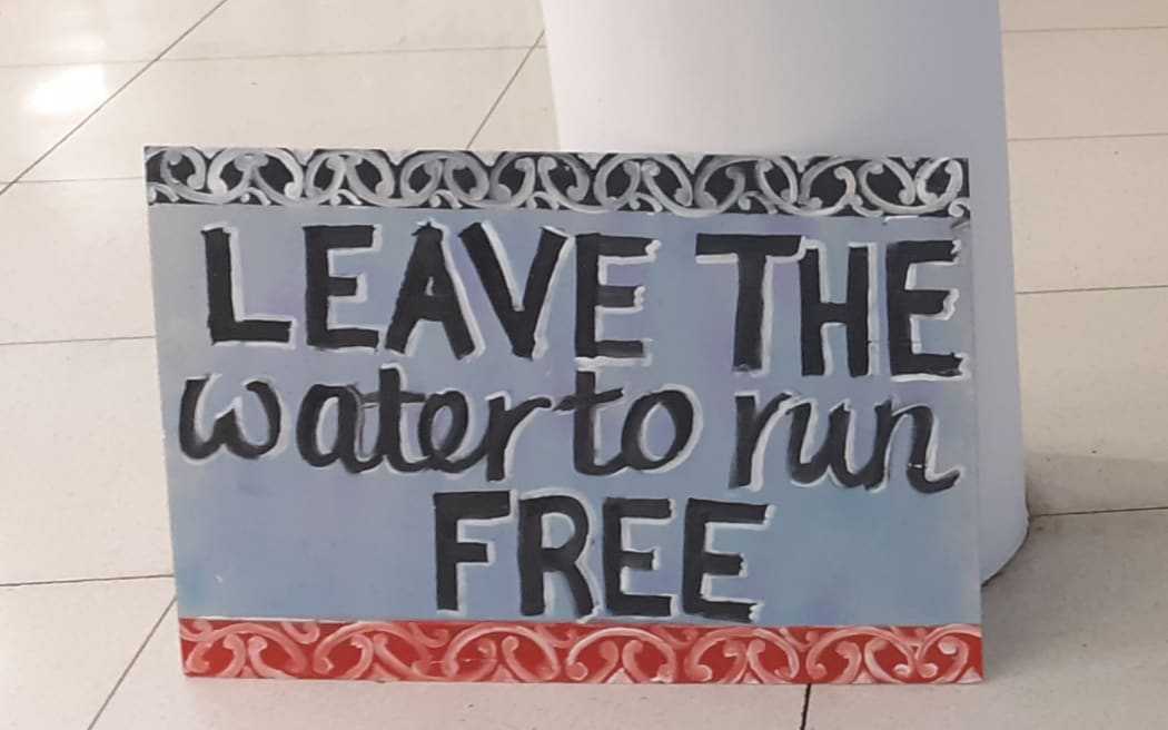 Signs greeting attendees at the water consent meeting at Whanganui War Memorial Centre.