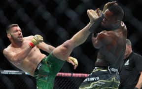 South Africa's Dricuc Du Plessis (L) and New Zealand's Israel Adesanya fight in their men's middleweight division event of the Ultimate Fighting Championship (UFC) 305 at the Perth Arena in Perth on August 18, 2024. (Photo by COLIN MURTY / AFP) / -- IMAGE RESTRICTED TO EDITORIAL USE - STRICTLY NO COMMERCIAL USE --