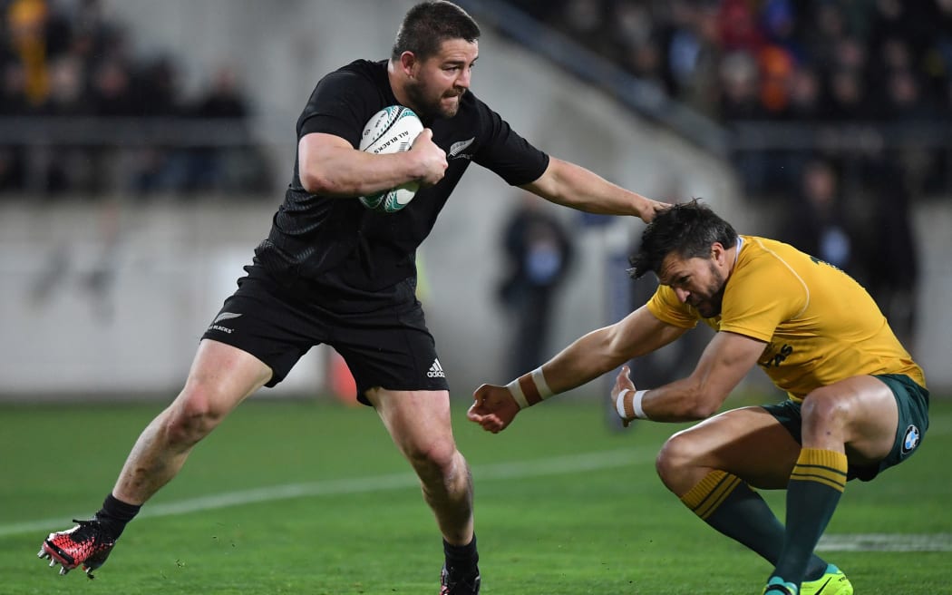 Dane Coles sees off Adam Ashley Cooper.