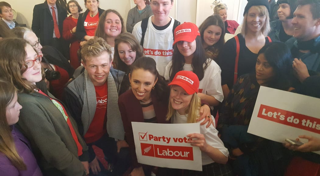 Jacinda Ardern surrounded by supporters.