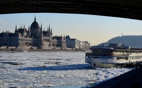 Ice floats in the water of the River Danube in Budapest on 8 January 2017, when extreme winter temperature set a new record in the capital with -18.6°C.