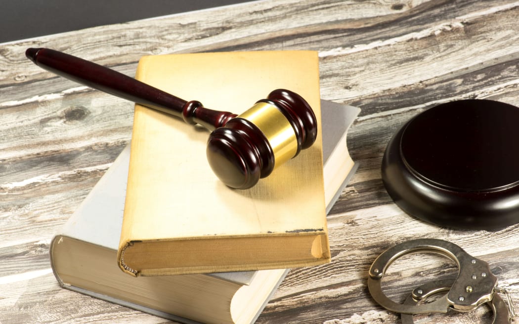 72653793 - a gavel, handcuffs and statutes