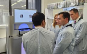 Health Minister Simeon Brown speaking to Illumina leaders during a visit of Canterbury Health Laboratories