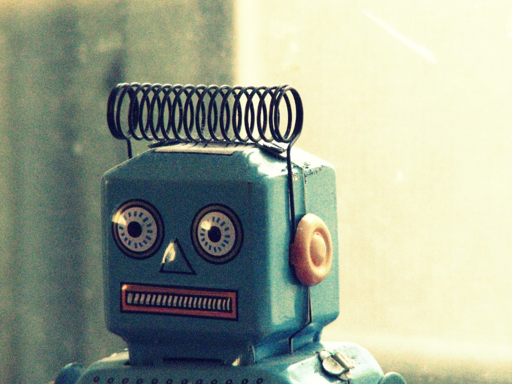 A 1950s toy robot, photographed is a close up of its head.