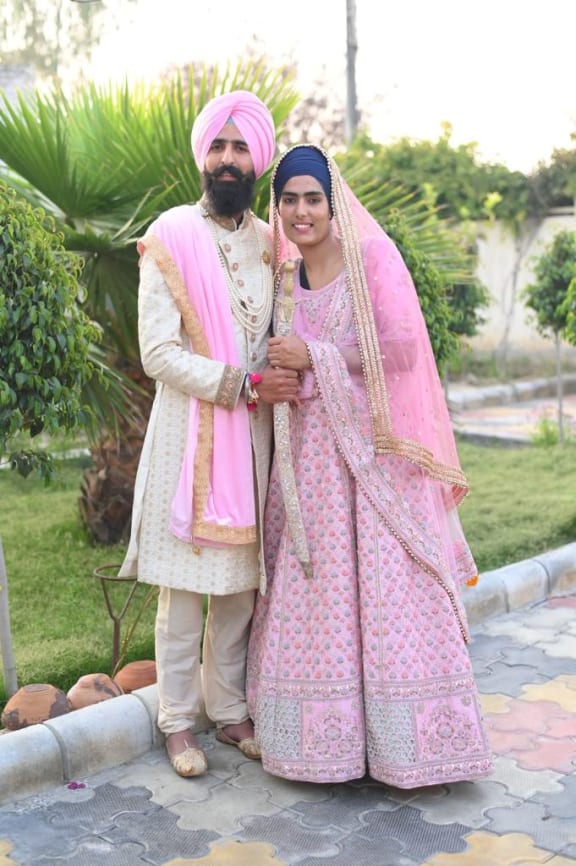 A ceremonial wedding photo of Prabhjot Singh and Navpreet Kaur