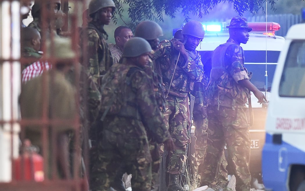 Soldiers killed four gunmen as they stormed a building.