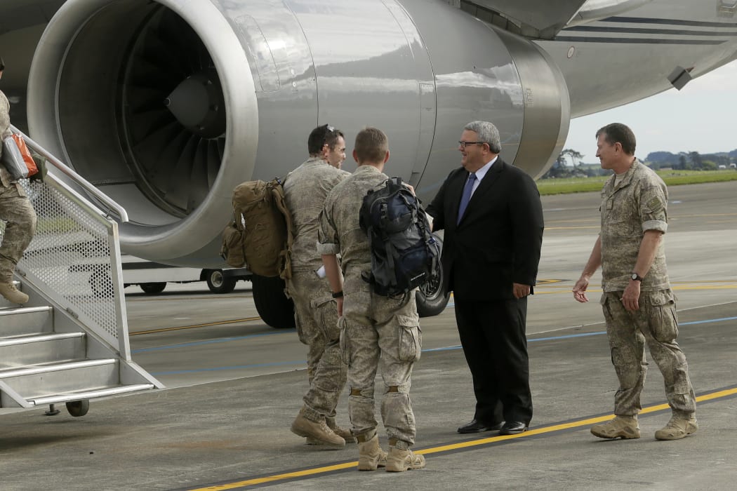 Troops returning from Iraq are welcomed by Defence Minister Gerry Brownlee and Commander Joint Forces New Zealand Major General Tim Gall, at the Ohakea Air Force Base on 16 November 2015.