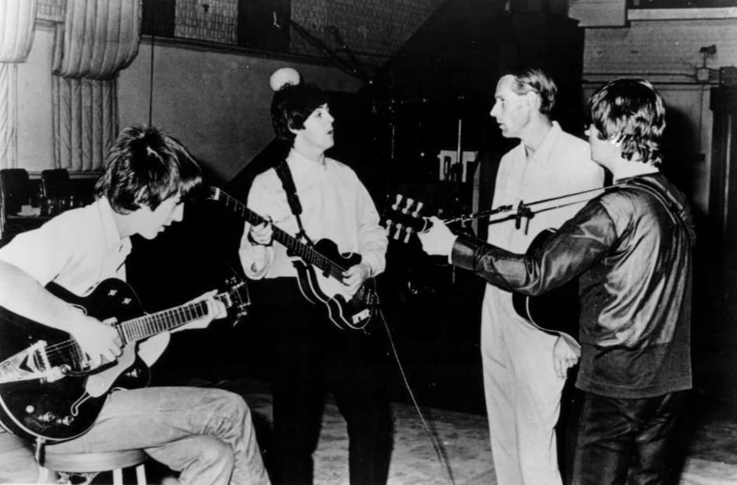 The Beatles George Harrison, Paul McCartney, producer George Martin and John Lennon
