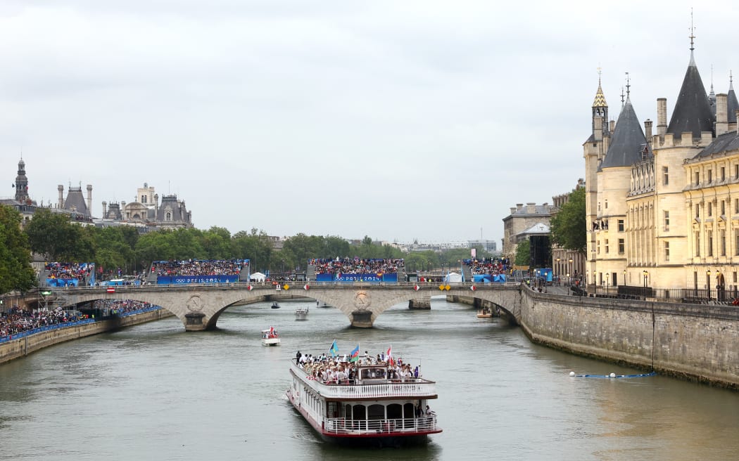 PARIS, FRANCE - JULY 26: Team Austria, Team Azerbaijan and Team Bahamas cruise during the athletes’ parade on the River Seine during the opening ceremony of the Olympic Games Paris 2024 on July 26, 2024 in Paris, France. (Photo by Maddie Meyer / POOL / AFP)