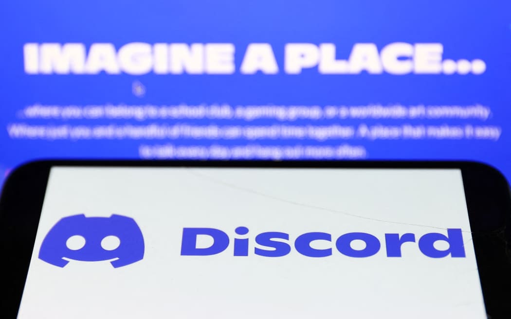 Discord logo displayed on a phone screen and Discord website displayed on a screen are seen in this illustration photo taken in Krakow, Poland on November 5, 2022. (Photo by Jakub Porzycki/NurPhoto) (Photo by Jakub Porzycki / NurPhoto / NurPhoto via AFP)

REDOWNLOADED 15/4/2023