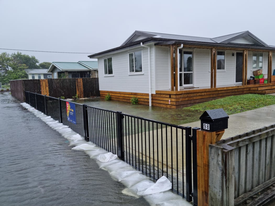 Sandbags stacked up at Derby Street, where residents prepare to evacuate as heavy rainfall threatens to flood the area.
