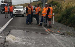 The burst pipe on SH1 near Plimmerton.