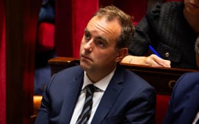 France's Minister of Armed Forces Sebastien Lecornu during the parliamentary extraordinary session prior to a confidence vote over the government austerity budget, at the National Assembly in Paris.