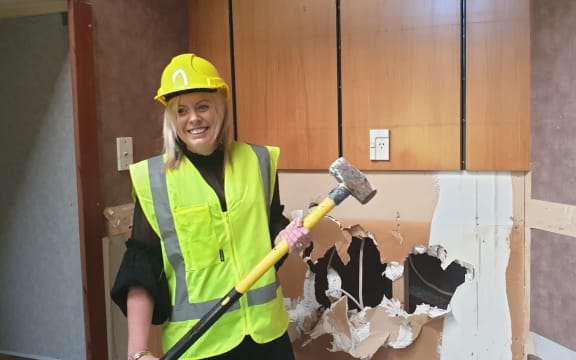 Melissa Vining was the first to strike the sledgehammer.