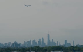Air New Zealand's inaugural flight NZ2 makes its descent above New York City.