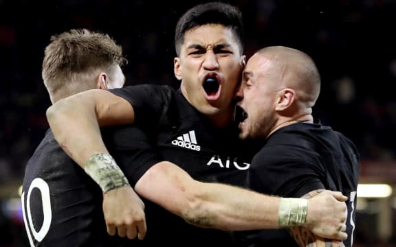 New Zealand's Rieko Ioane celebrates scoring a try with Beauden Barrett and TJ Perenara.