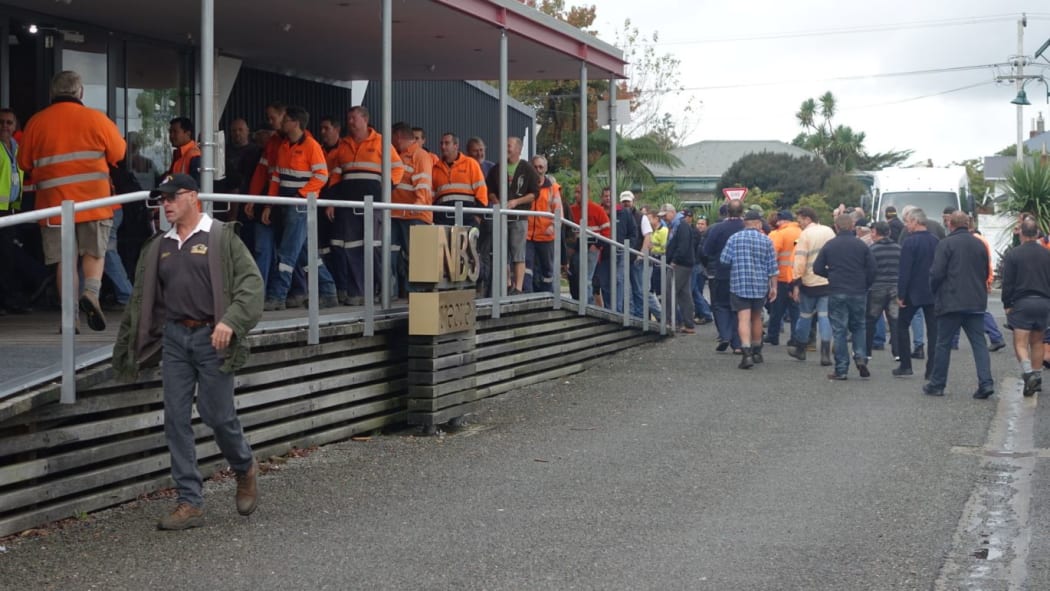 Workers attend today's meeting.