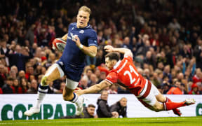 Duhan van der Merwe of Scotland evades the tackle of Tomos Williams of Wales on the way to scoring during the 2024 Six nations Championship, rugby union match between Wales and Scotland on 3 February 2024 at Millenium Stadium in Cardiff, Wales - Photo Simon King / ProSportsImages / DPPI (Photo by Simon King / ProSportsImages / DPPI via AFP)